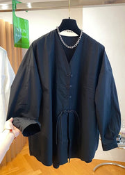 Dark blue jacket with a chain detail on a hanger in a store setting.