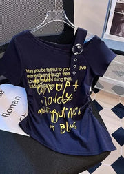 Navy blue t-shirt with yellow text on a chair in a room with a newspaper and decorative items.