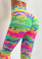Colorful camouflage leggings on a plain background