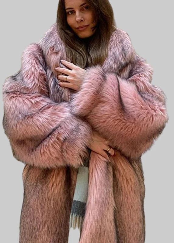 Person wearing a pink fur coat in an indoor setting with decorative elements.