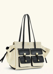 Beige handbag with black accents on a white background