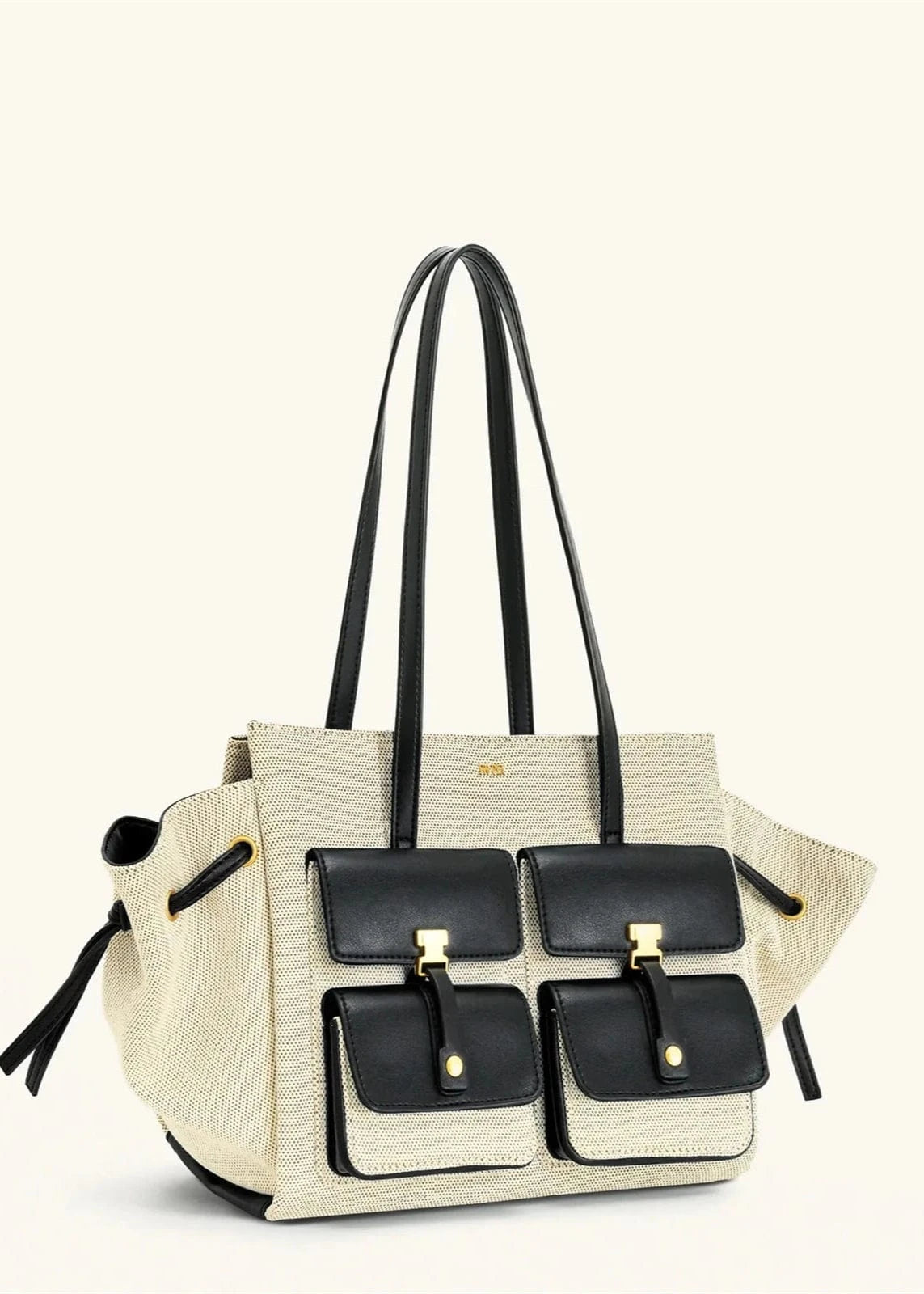 Beige handbag with black accents on a white background