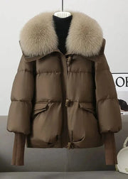 Brown puffer jacket with fur hood on a mannequin against a neutral background