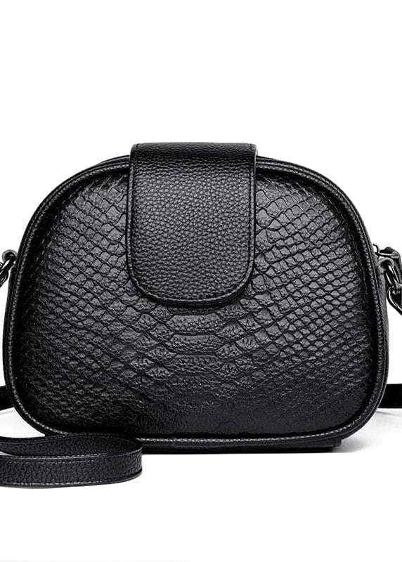 Black textured handbag with a strap on a white background