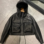 Black leather jacket with a hood on a tiled floor