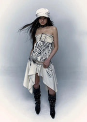 Model wearing a unique outfit with a white dress, black boots, and a white cap against a light gray background