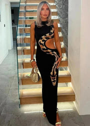 Teonclothingshop Bold and Chic: Black Cut-Out Snake Print Dress