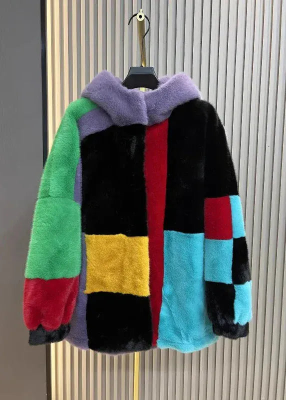 Multicolored jacket with a hood on a mannequin against a neutral background