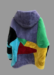 Colorful hoodie with patchwork design hanging on a radiator, branded 'AMY&BENTON'.