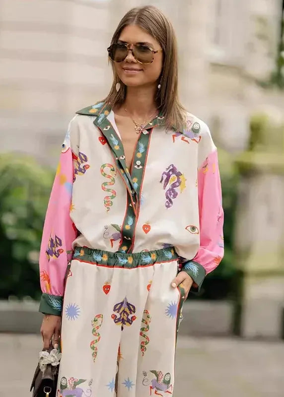 Woman wearing a colorful outfit with a floral pattern in an outdoor setting