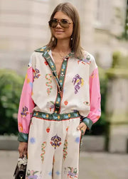 Woman wearing a colorful outfit with a floral pattern in an outdoor setting