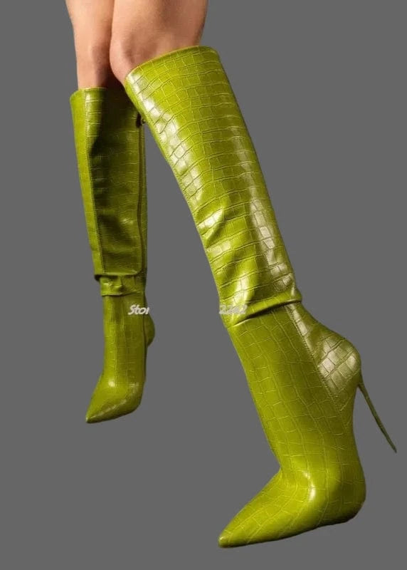 Green knee-high boots on a black background