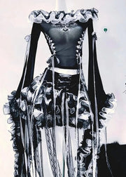 Black and white outfit with ruffled details on a plain background