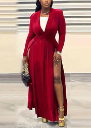 Woman wearing a red dress with a white top, gold shoes, and clutch.