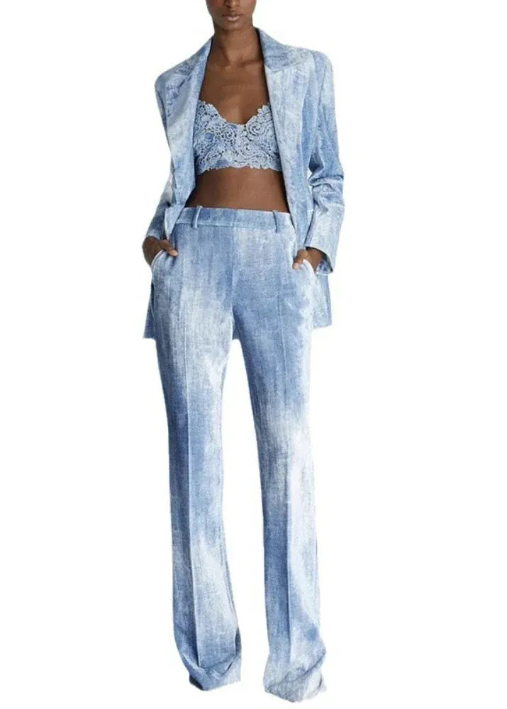 Woman wearing a light blue denim outfit with a matching jacket on a white background, featuring the brand 'TwoTwinStyle'.