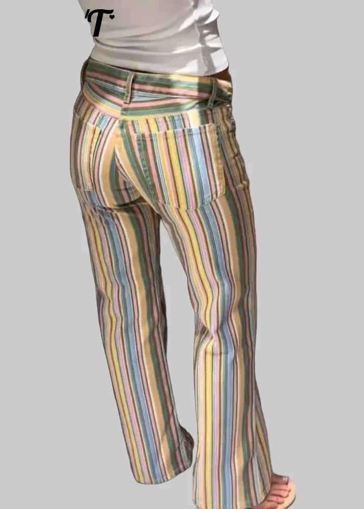 Multicolored striped pants worn by a person in a neutral setting