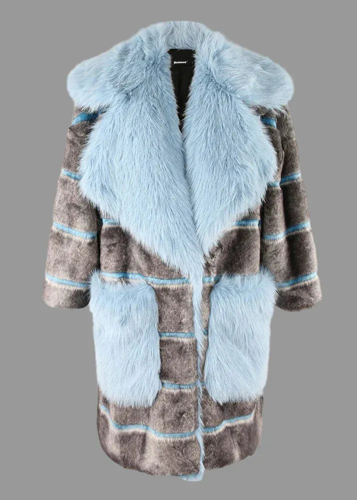 Coat with blue fur collar and cuffs on a light gray background