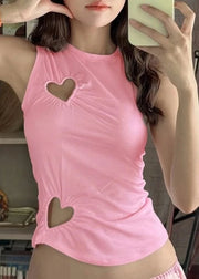 Person wearing a pink tank top with heart cutouts, taking a mirror selfie.