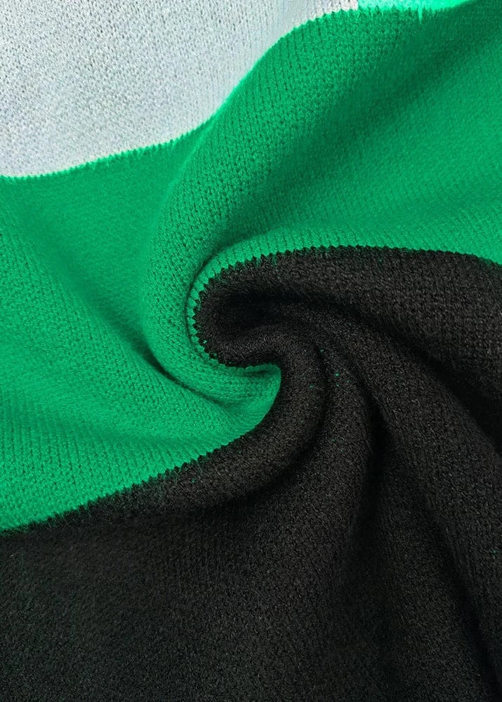 Close-up of green and black fabric with a textured pattern