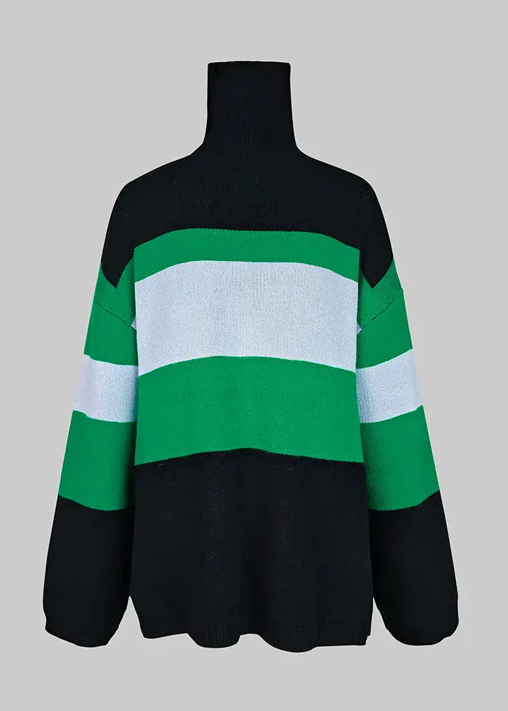Black, green, and white striped sweater on a mannequin against a gray background