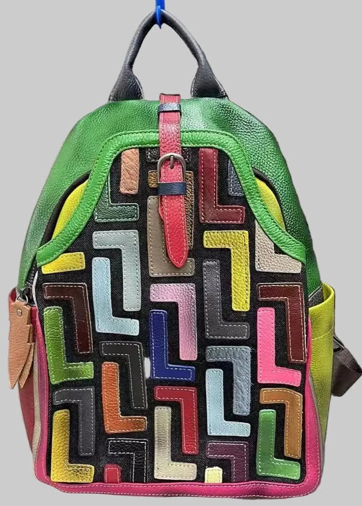 Colorful geometric-patterned backpack on a textured gray background