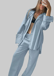 Person wearing a light blue outfit in a studio setting with 'Cladive' branding.