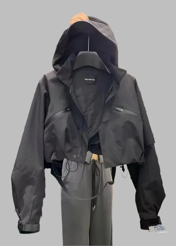 Dark gray jacket with brand logo on a hanger in a store setting