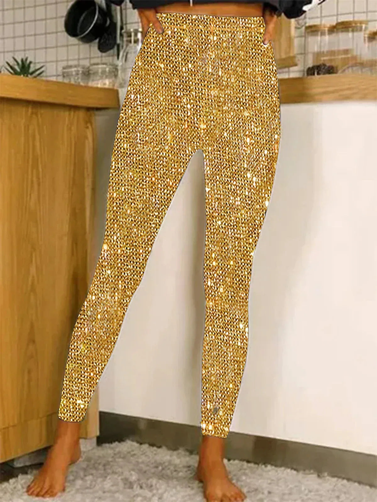 Person wearing gold sequin pants in a kitchen setting