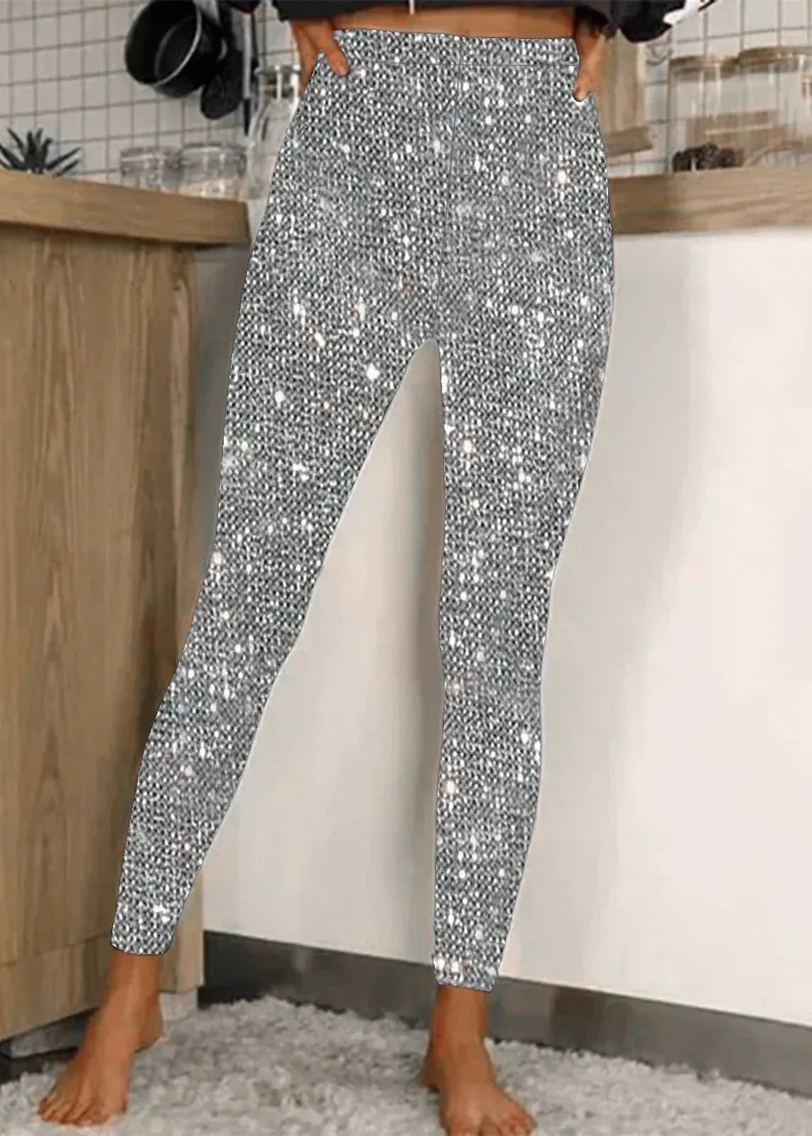 Person wearing sparkly silver pants in a kitchen setting