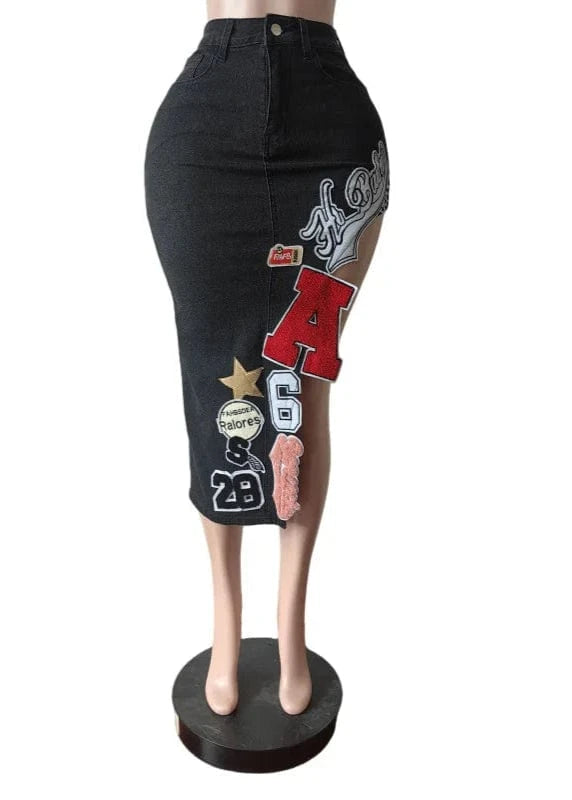 Black denim skirt with patches on a mannequin against a white background