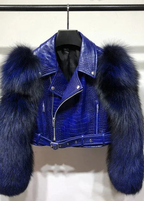 Blue leather jacket with fur sleeves on a hanger against a white background