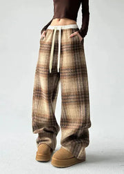 Plaid pants worn by a person on a white background