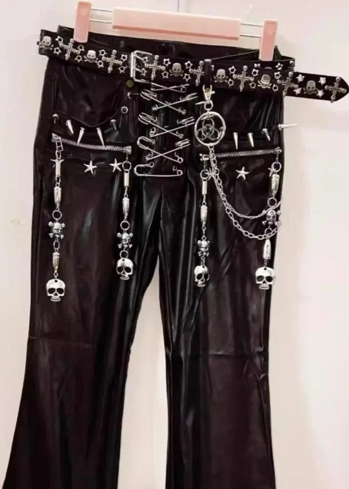 Black leather pants with silver chain and skull embellishments on a white background