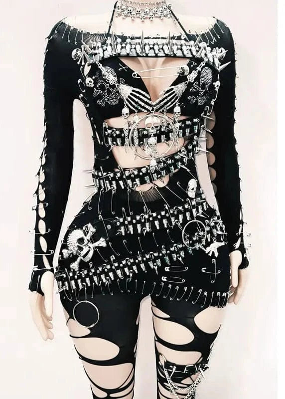Black and white outfit with intricate designs on a mannequin against a white background