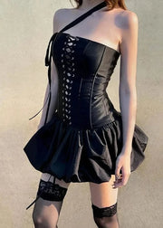 Black corset dress with lace-up front and ruffled skirt on a plain background