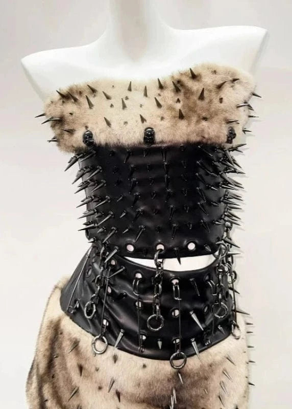 Black leather corset with spikes and fur on a mannequin against a white background