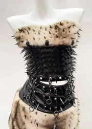 Black leather corset with spikes and fur on a mannequin against a white background