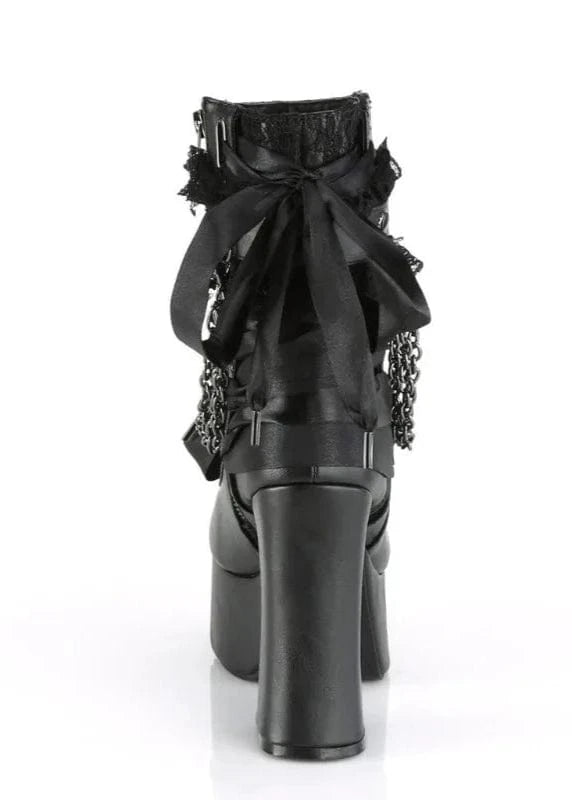 Black high-heeled boot with decorative bow and embellishments on a white background