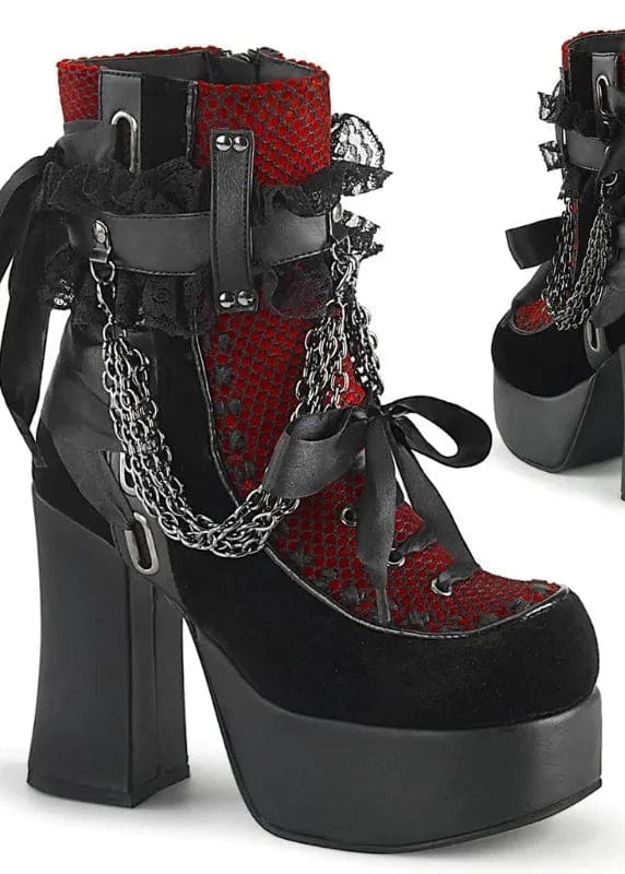 Black and red platform boots with chain details on a white background
