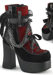 Black and red platform boots with chain details on a white background