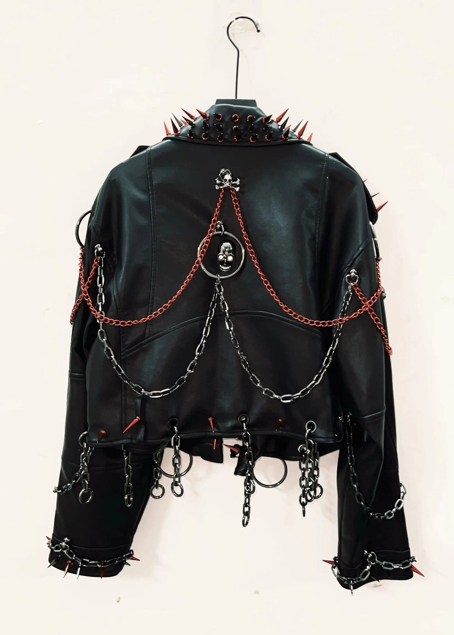 Black leather jacket with chains and spikes on a white background
