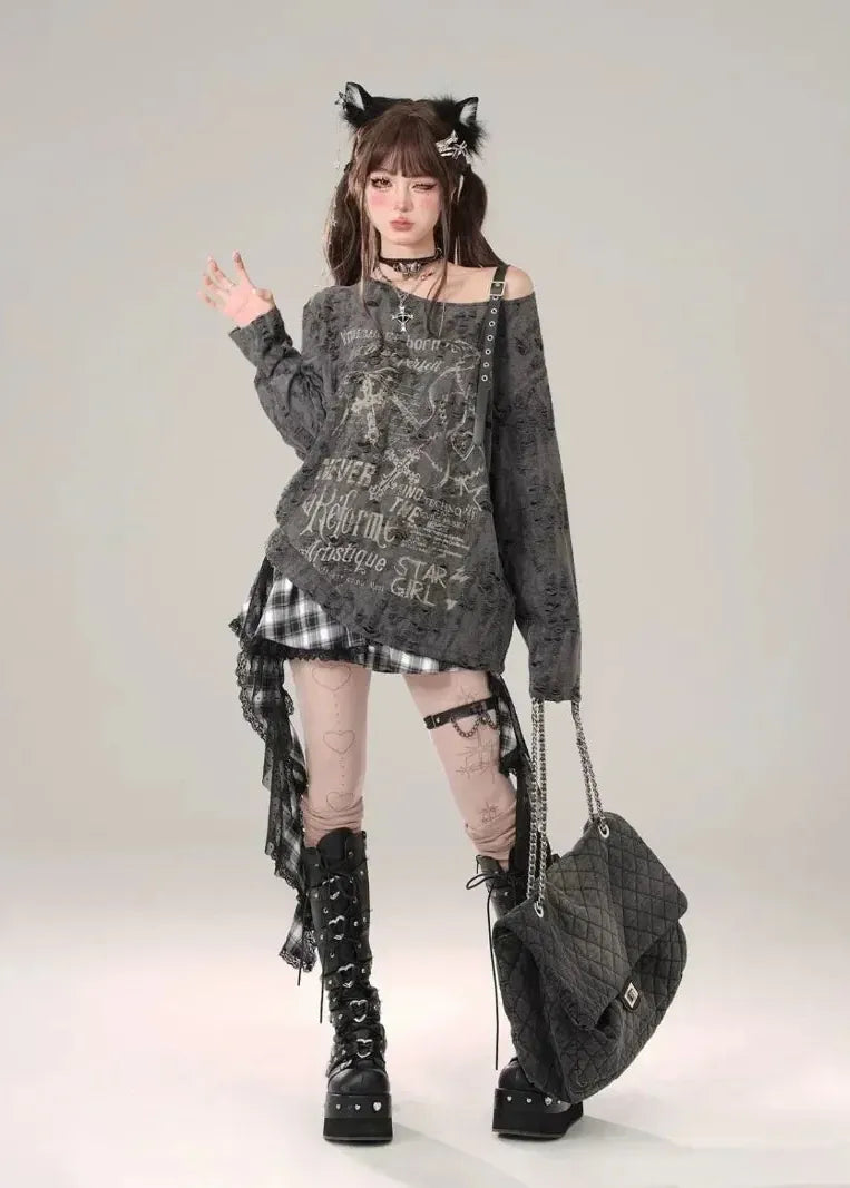 Person wearing a dark, stylish outfit with a bag on a plain background