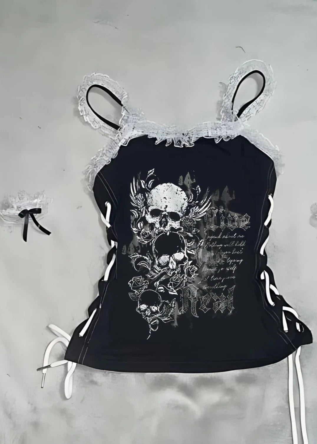 Black tank top with skull design on a light gray background