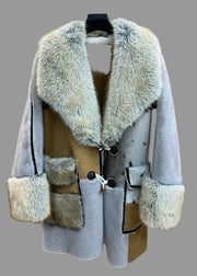 Gray coat with fur accents on a mannequin against a neutral background, featuring the brand 'Amy & Benton'.