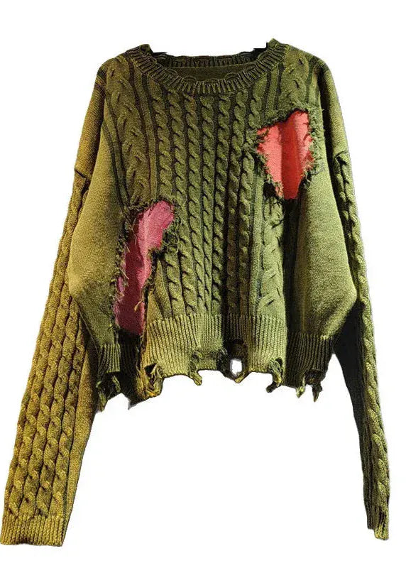 Green sweater with red heart designs on a white background