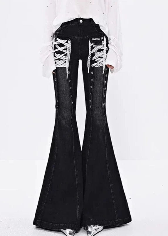 Black bell-bottom jeans with lace-up details on a white background