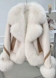 White fur coat with brown accents on a chair