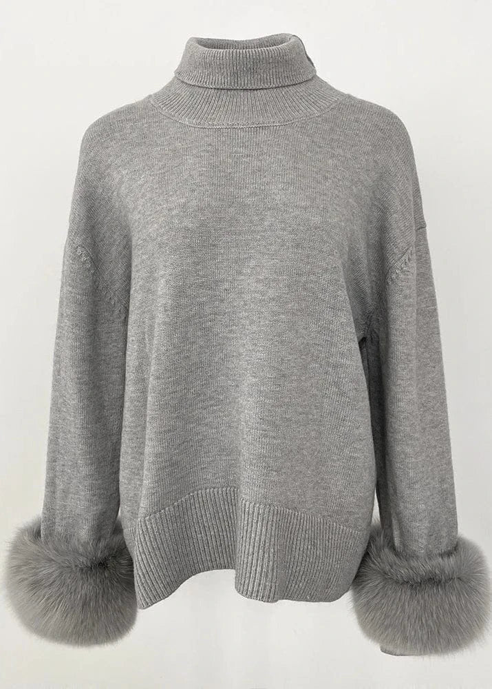 Gray sweater with fur cuffs on a white background