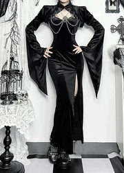 Person wearing a black gothic outfit in a decorated room with candles and lace.
