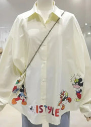 White shirt with cartoon character designs and 'ISTYLE' text on a mannequin.